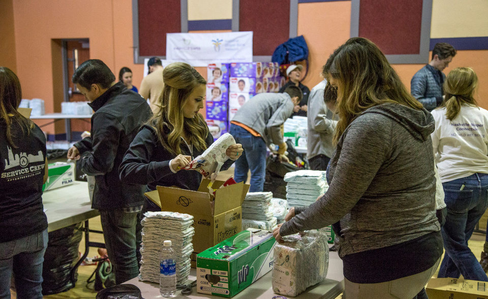 Team members work together to wrap diapers for families in the Nashville area.